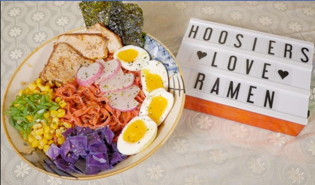 Colorful bowl with purple cabbage, radish, carrot, corn, and eggs — Hoosiers Love Ramen