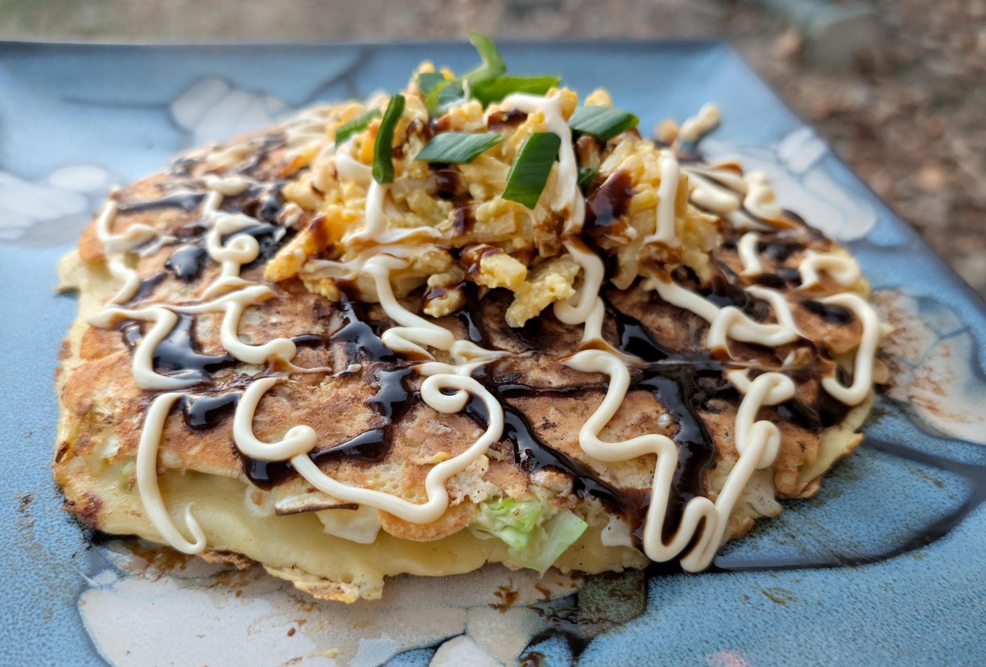Okonomiyaki with otafuku sauce, kewpie mayo, and green onion